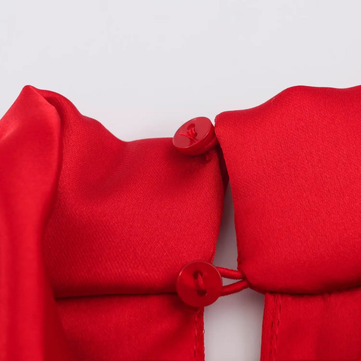 Close-up of matching buttons at back neckline
