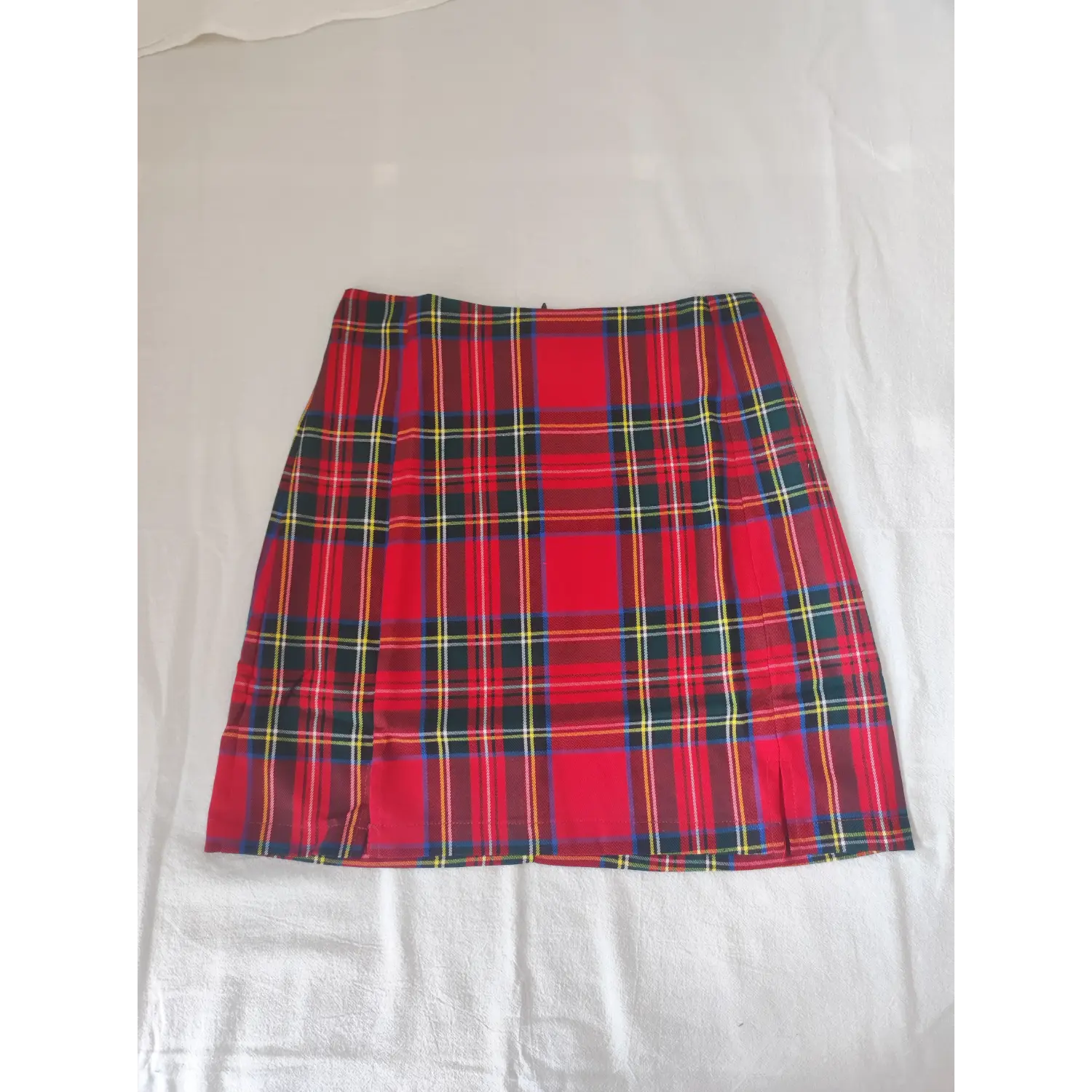 Flat lay front view, red tartan high waist mini skirt on white background