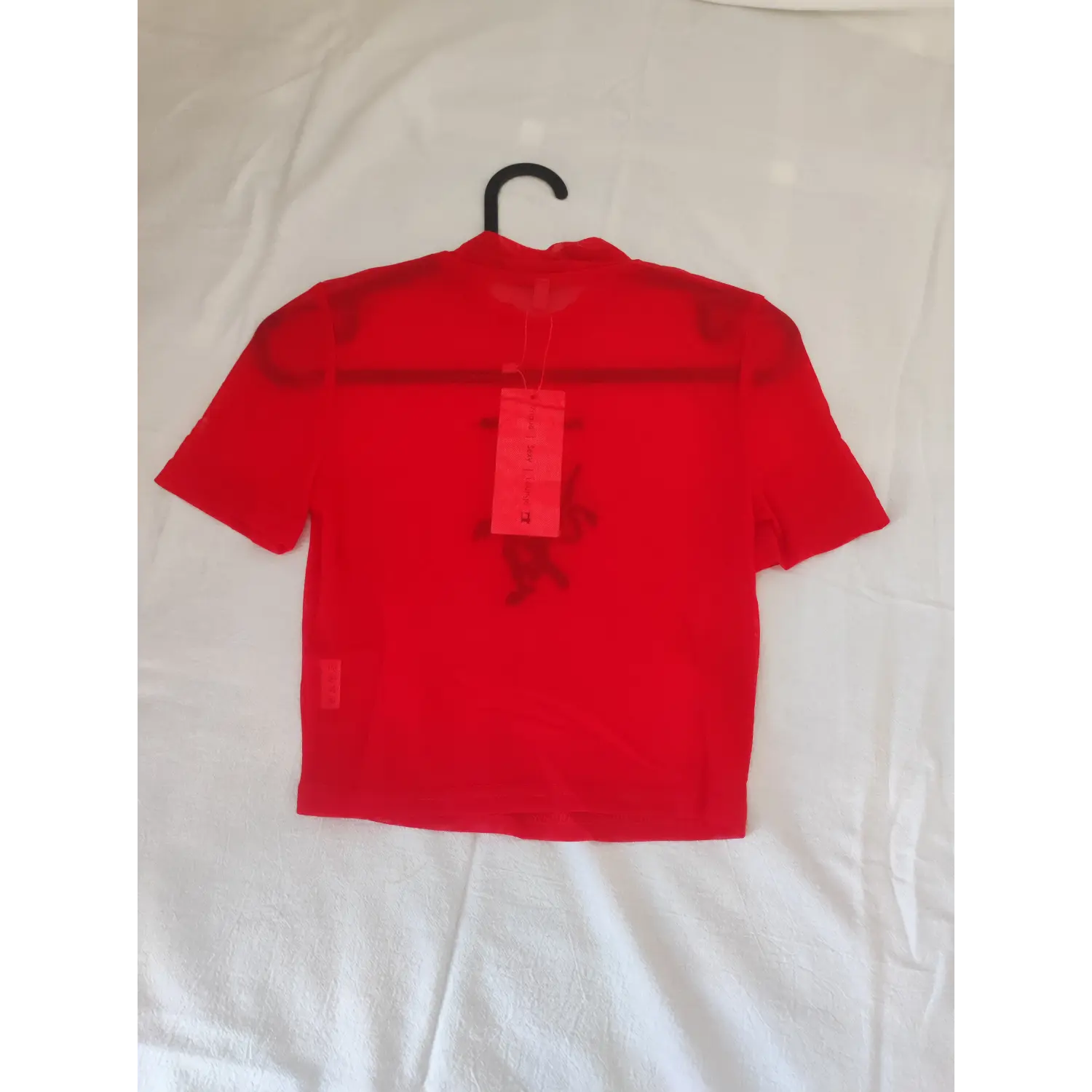 Flat lay back view, solid back red mesh mock neck cropped tee with attached tag