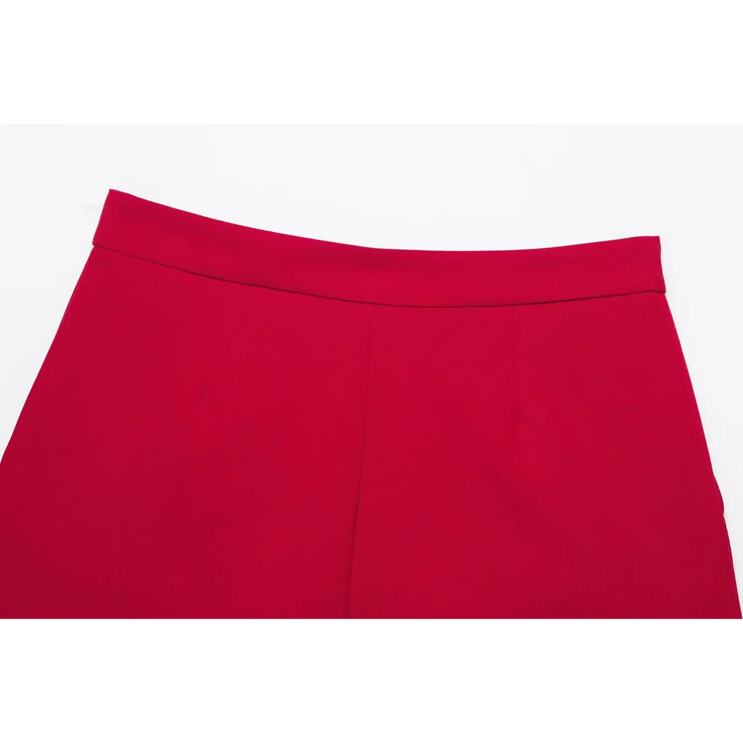 Close‑up back waist panel of red suit shorts, wide waistband, clean seam lines, smooth red suiting fabric, white background