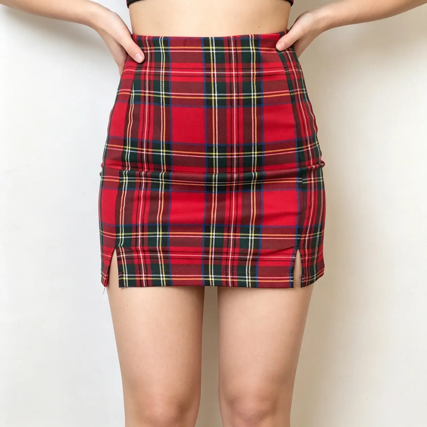 Model front full shot, red plaid high waisted mini skirt two side slits design