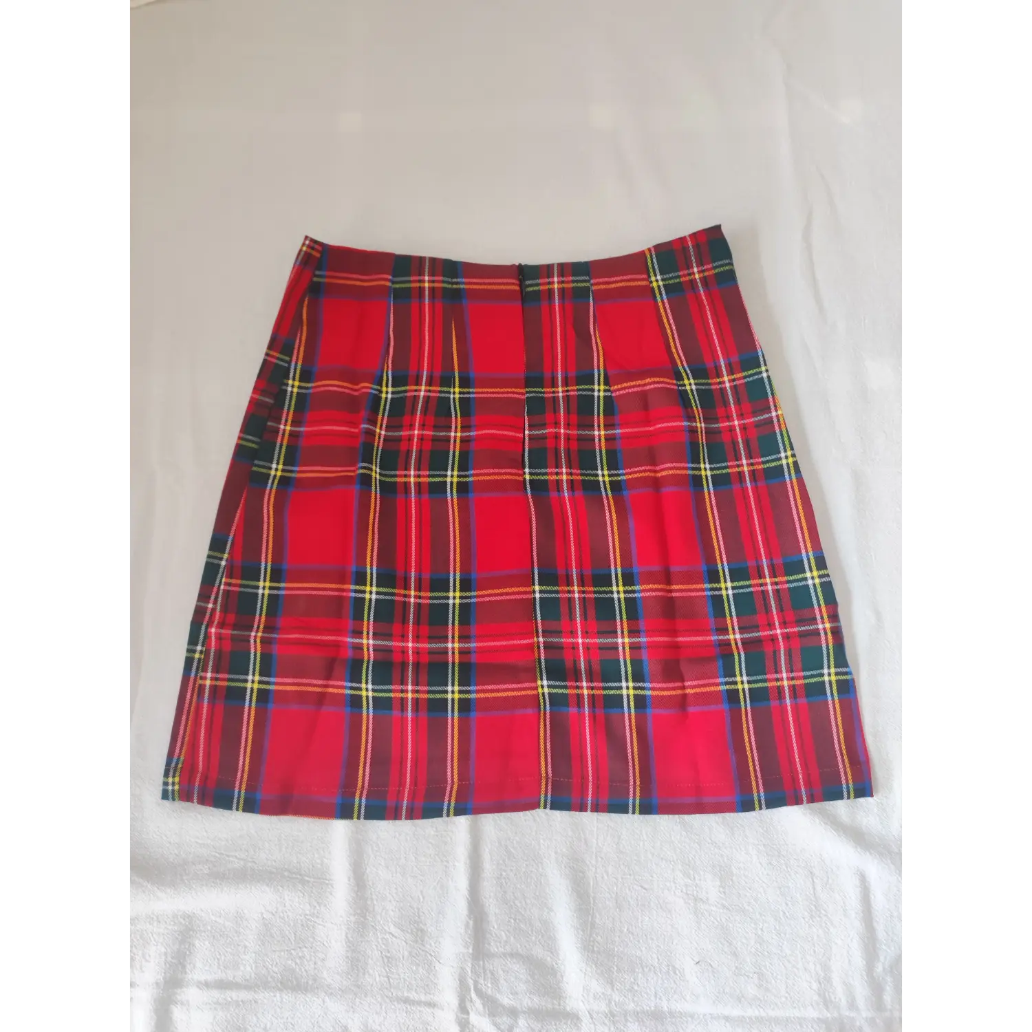 Flat lay back view, red scottish plaid high waist mini skirt