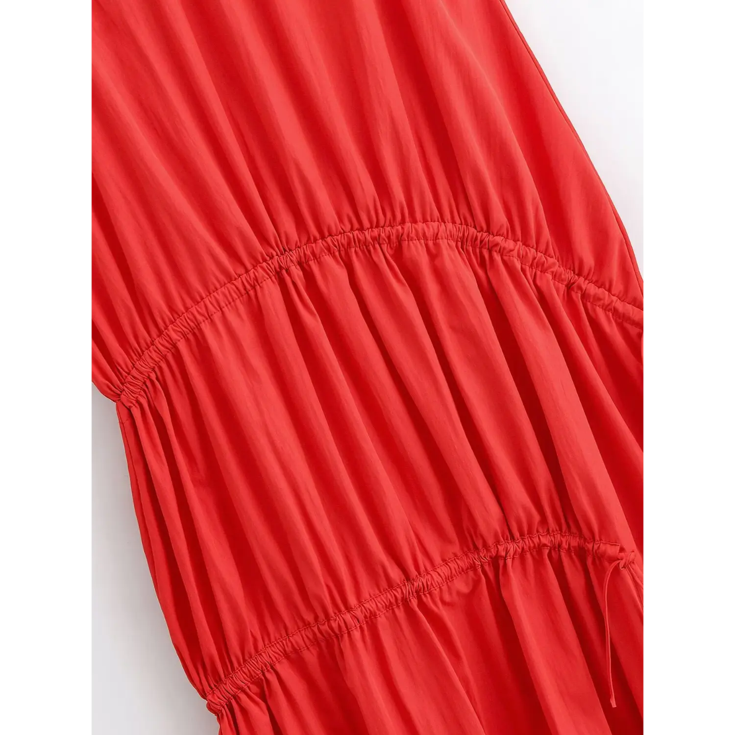 Macro texture of double horizontal elastic ruched waist panels, natural soft vertical wrinkle fabric, tiered separation stitching detail