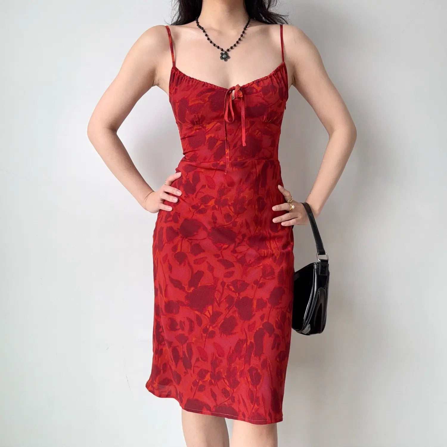 Front outfit photo with hands on hips, showing fitted waist and slight mermaid hem silhouette