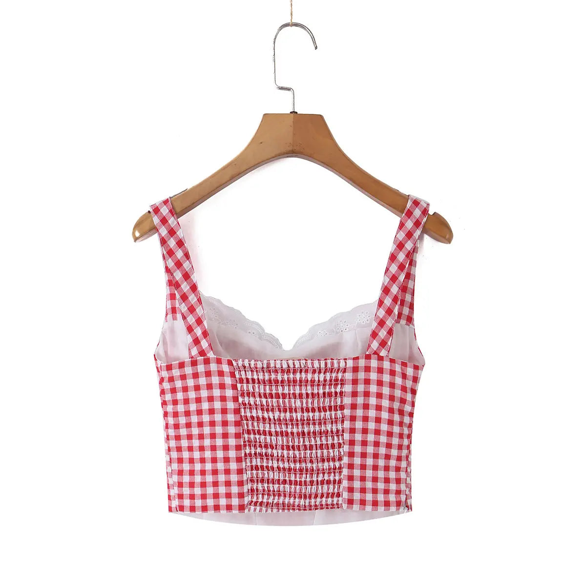 Back view of a red and white gingham bustier tank top hung on a wooden hanger, showing the smocked panel and lace-trimmed inner layer.
