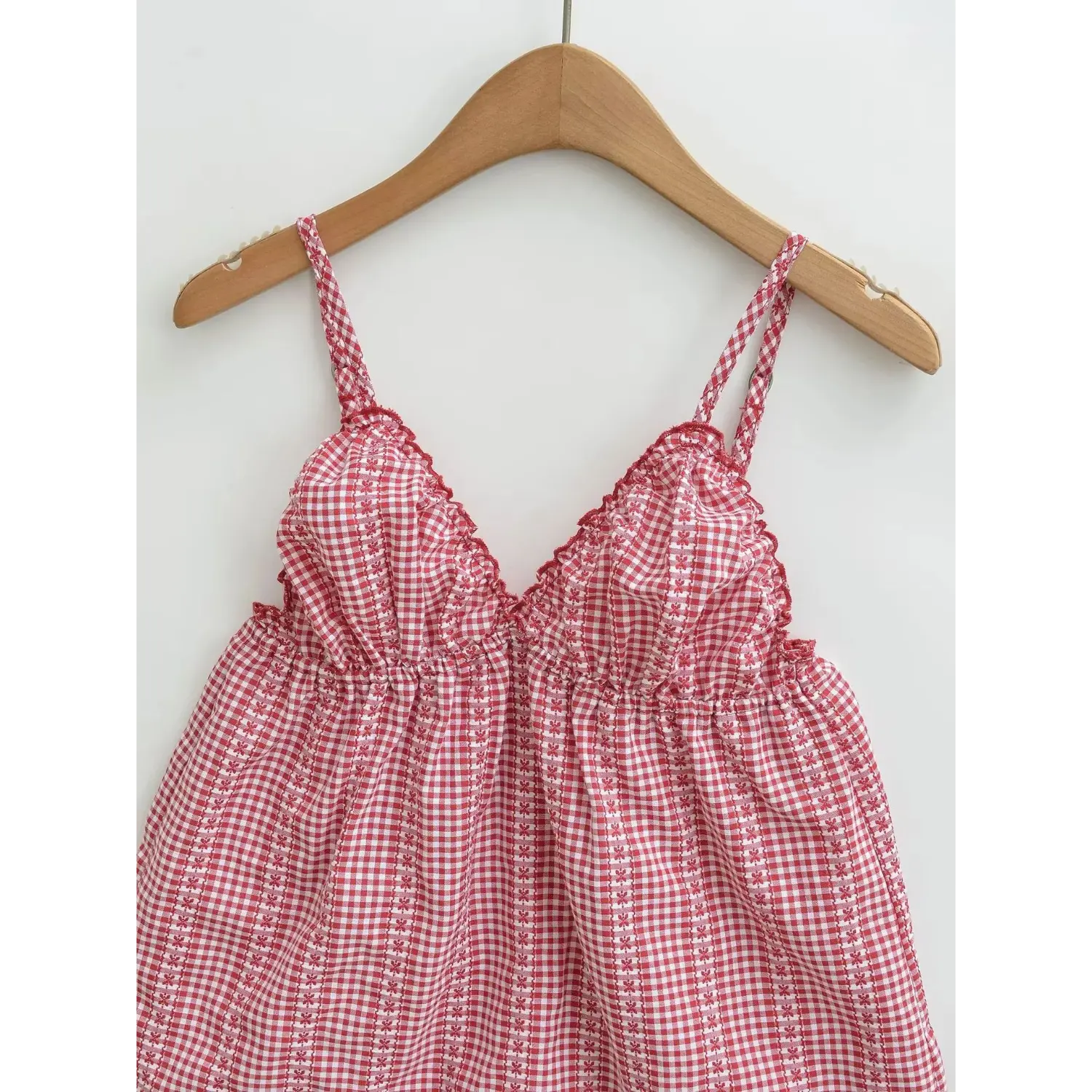 Red white gingham floral cami top hanger front flat product shot, adjustable buckle thin straps scalloped v-neck gathered bust loose babydoll chiffon camisole white background photo