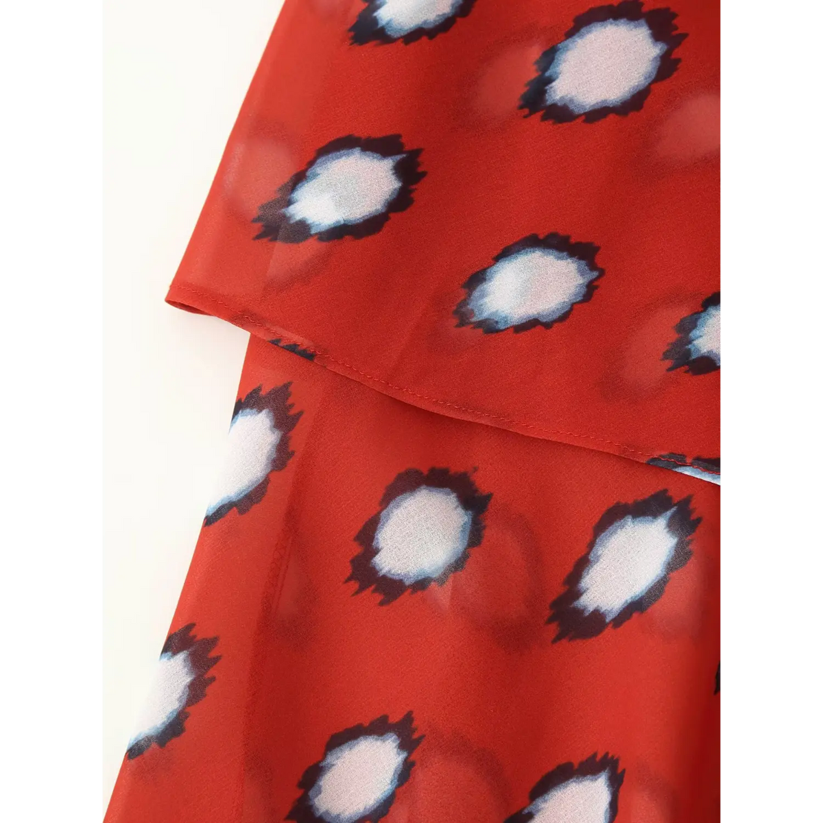 Detail shot of side twist knot and layered ruffle skirt