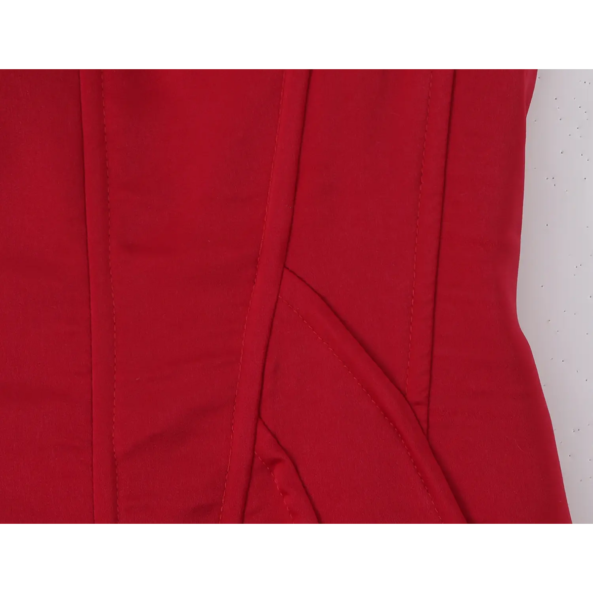 Close‑up of corset bodice stitching and seam detail