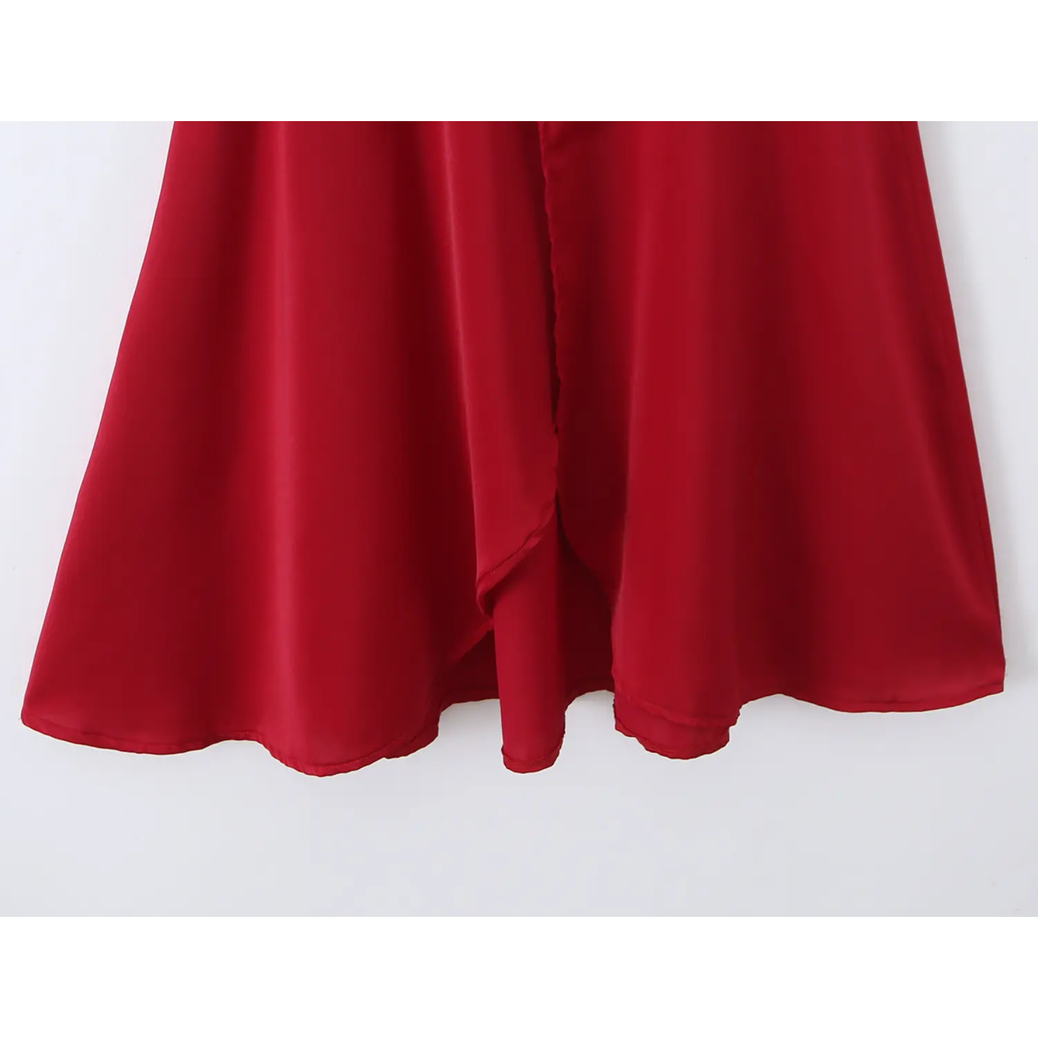 Partial view of wrap skirt with front slit detail