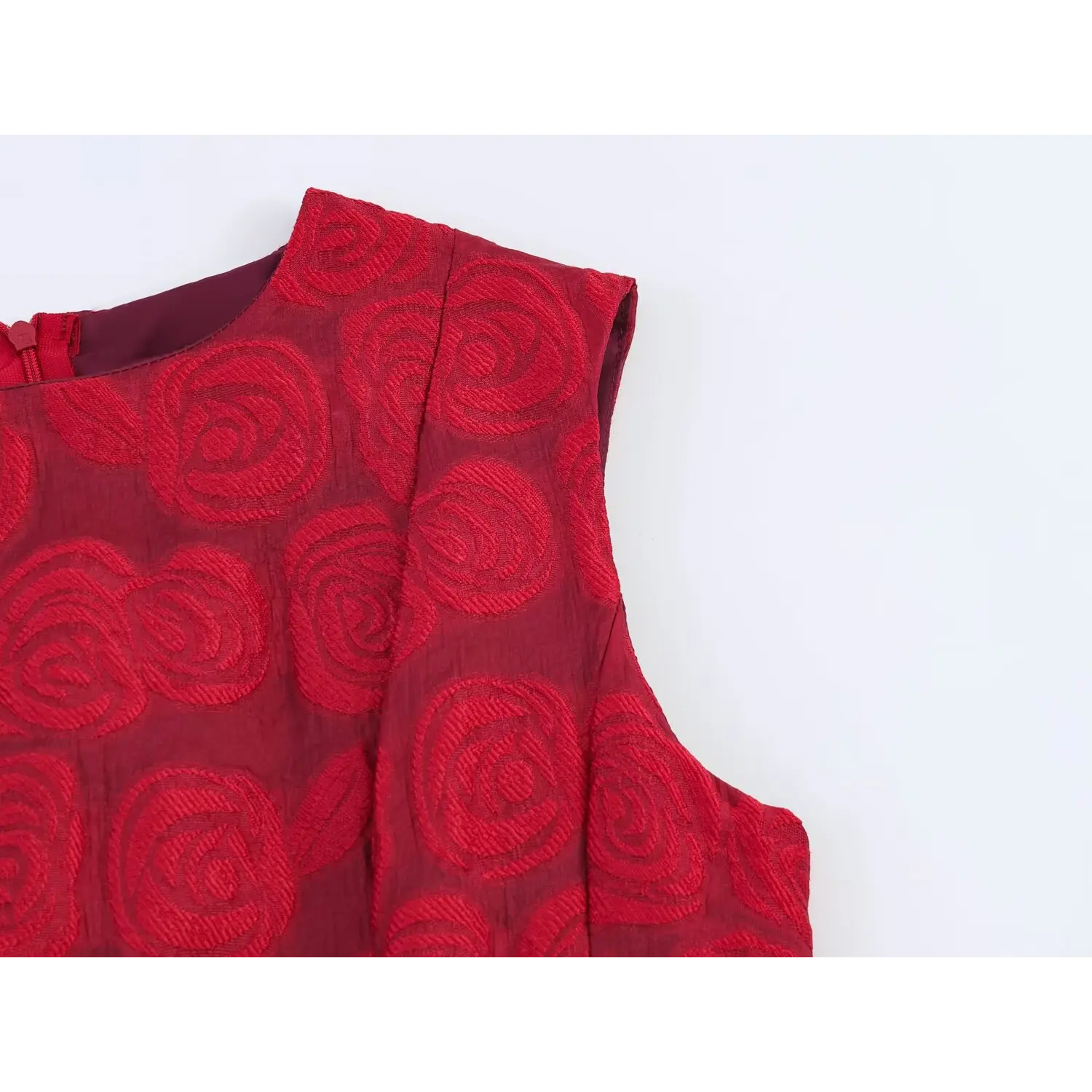 Close‑up of round neckline and sleeveless armhole detail