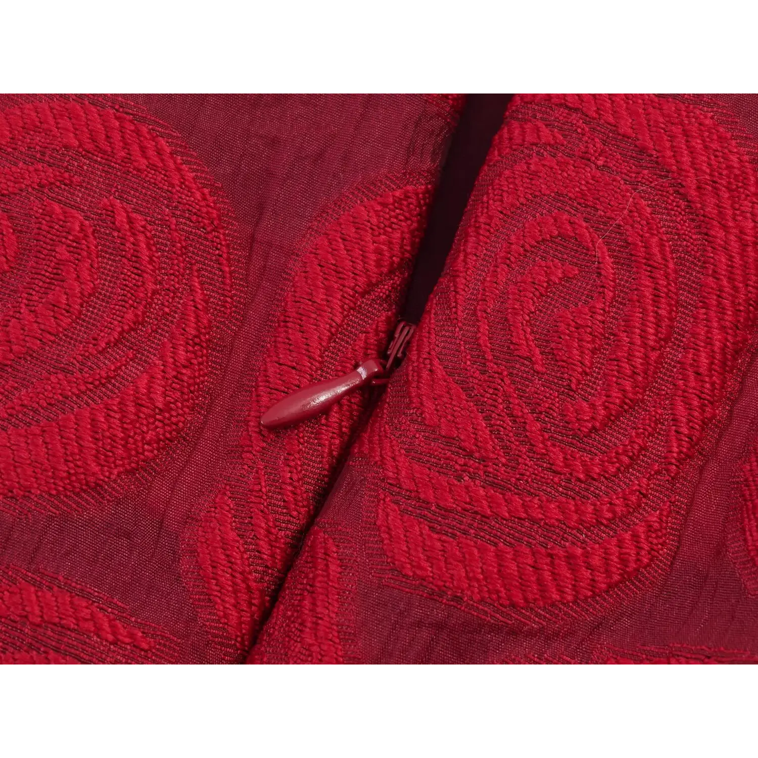 Partial close‑up of hidden side zipper on jacquard fabric