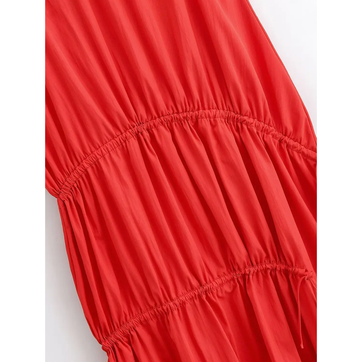 Detailed shot of gathered tiered skirt stitching and drawstring design