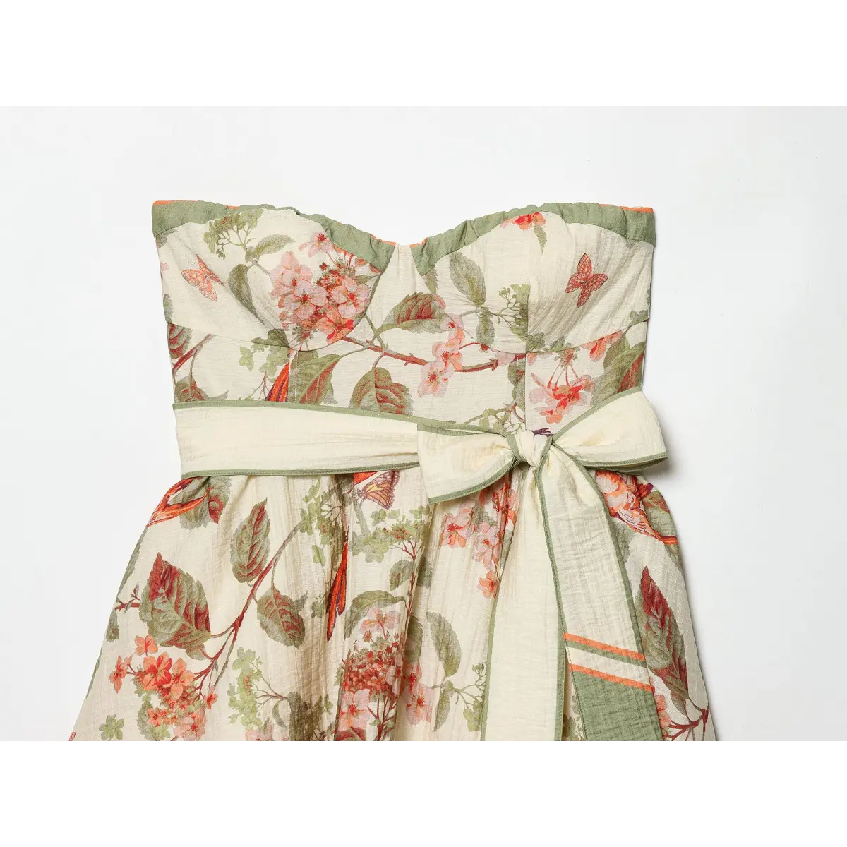 Front bust & waist close of vintage botanical print sundress, elastic ruffled strapless neckline + wide self-fabric waistband with oversized side bow tie.