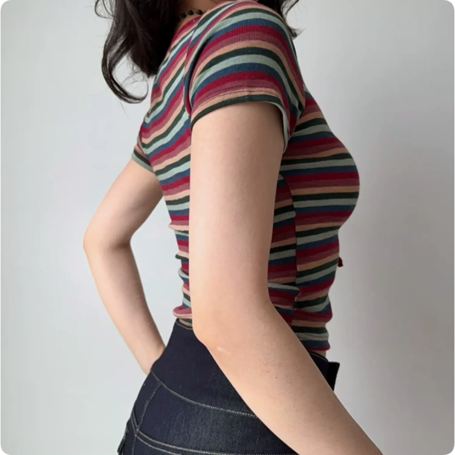 Side profile shot retro multicolor stripe ribbed cropped t shirt, ruched waist stretch slim women streetwear top