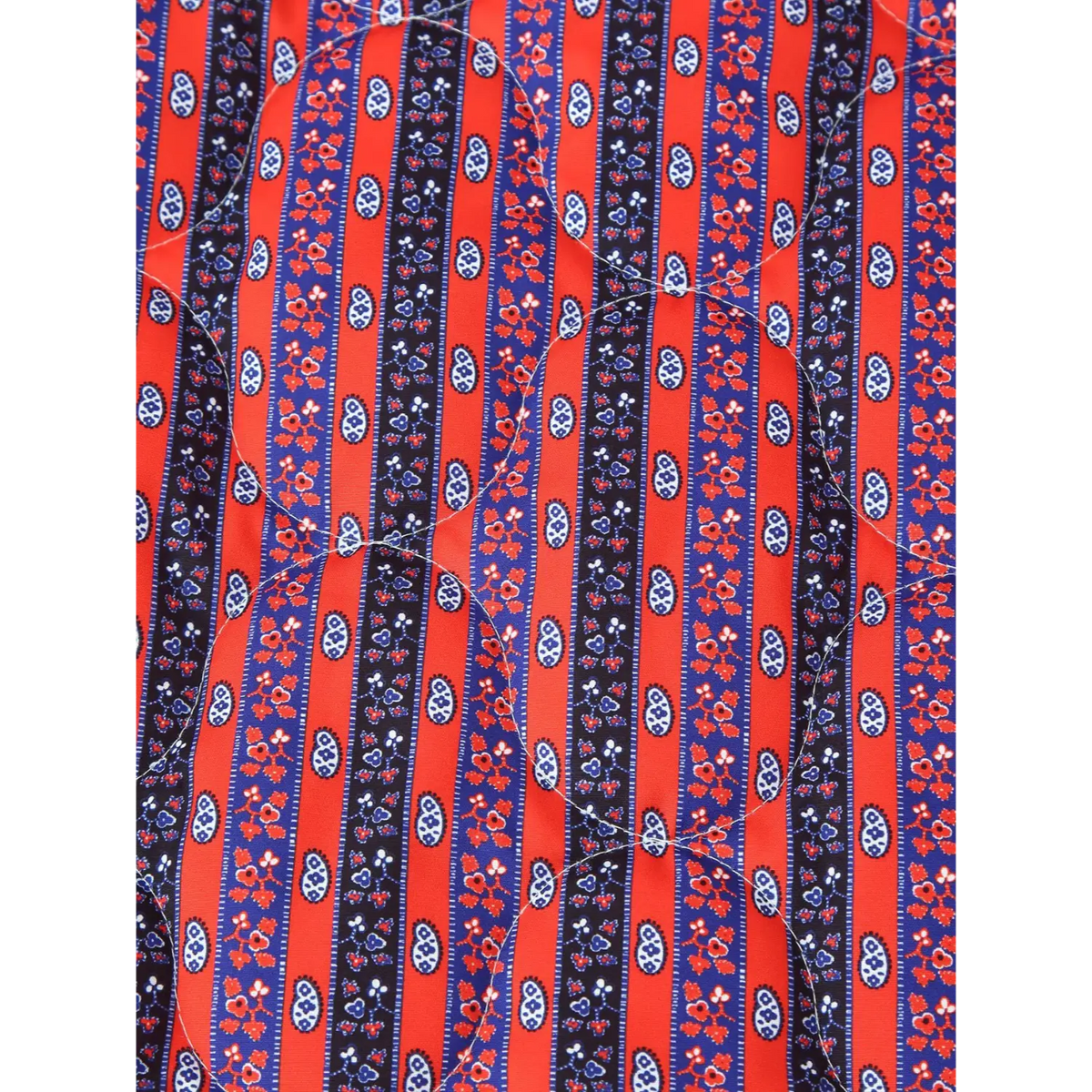 Close-up of red blue stripe paisley fabric
