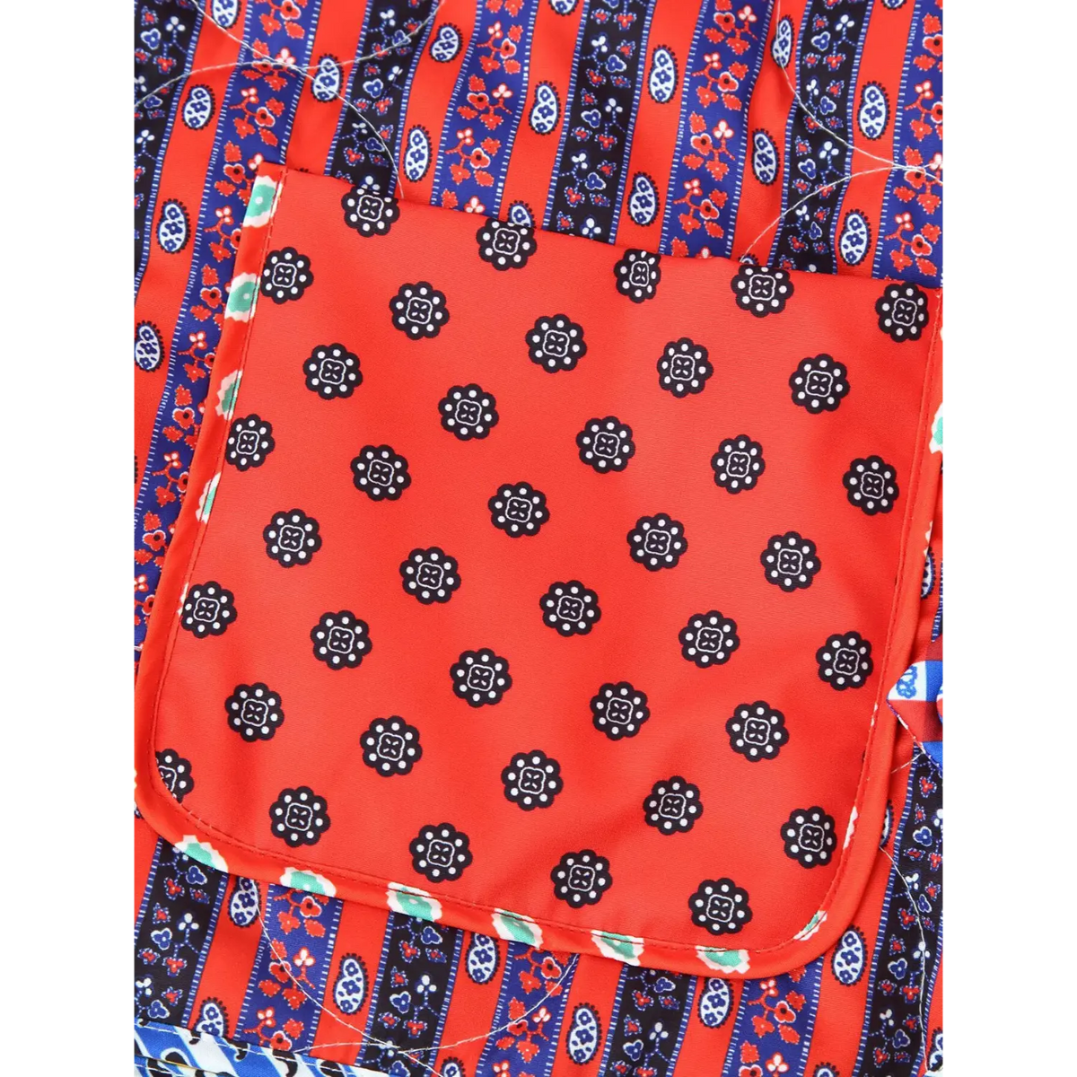Close-up of red floral dot patch pocket