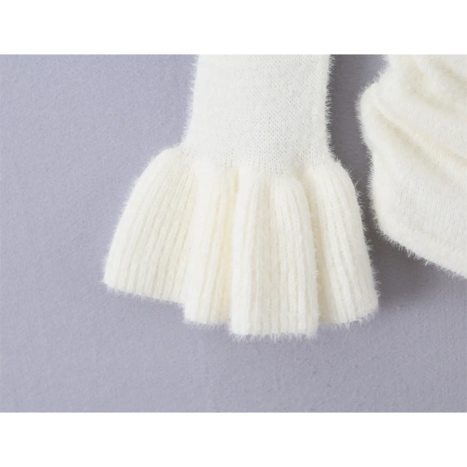 Close up ribbed knit flared bell cuff sleeve, soft fuzzy mink fleece fabric stretch long sleeve top detail