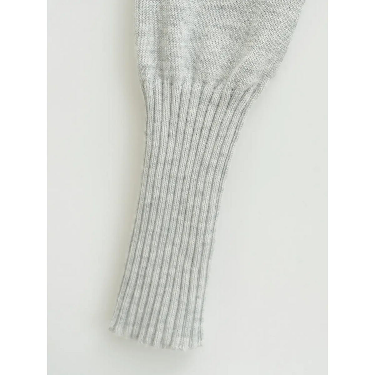 Close-up of long sleeve ribbed cuff, stretchy knitted hem for the lace trim cardigan