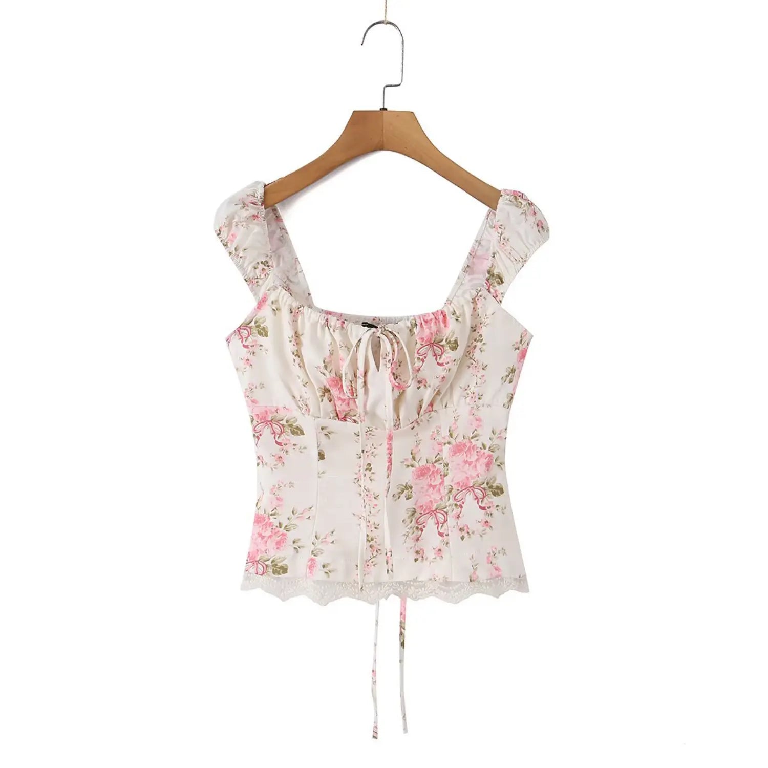 Front view of the rose print square-neck top hanging on a wooden hanger, showing the square neckline and tie detail