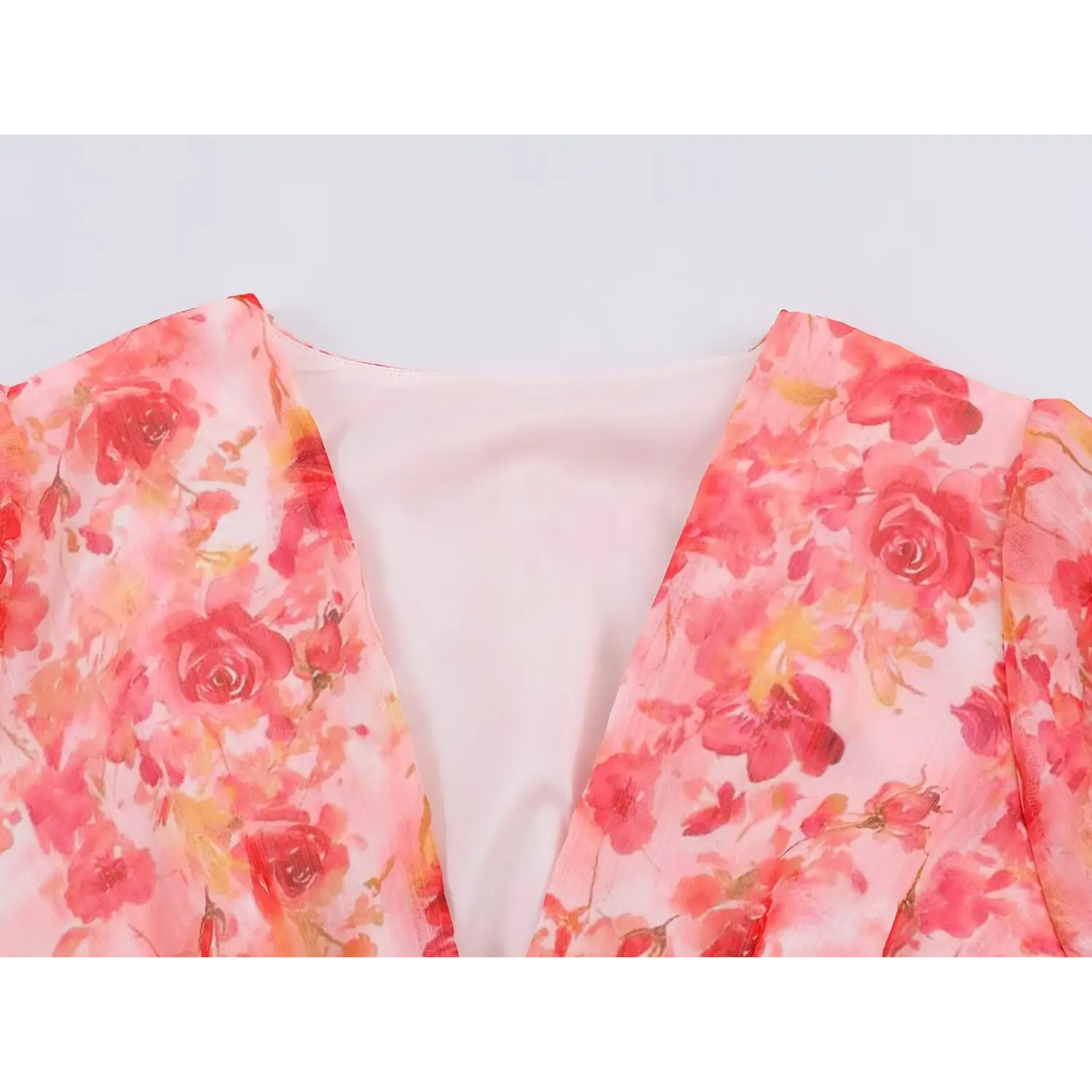Close-up of V neckline and rose floral print