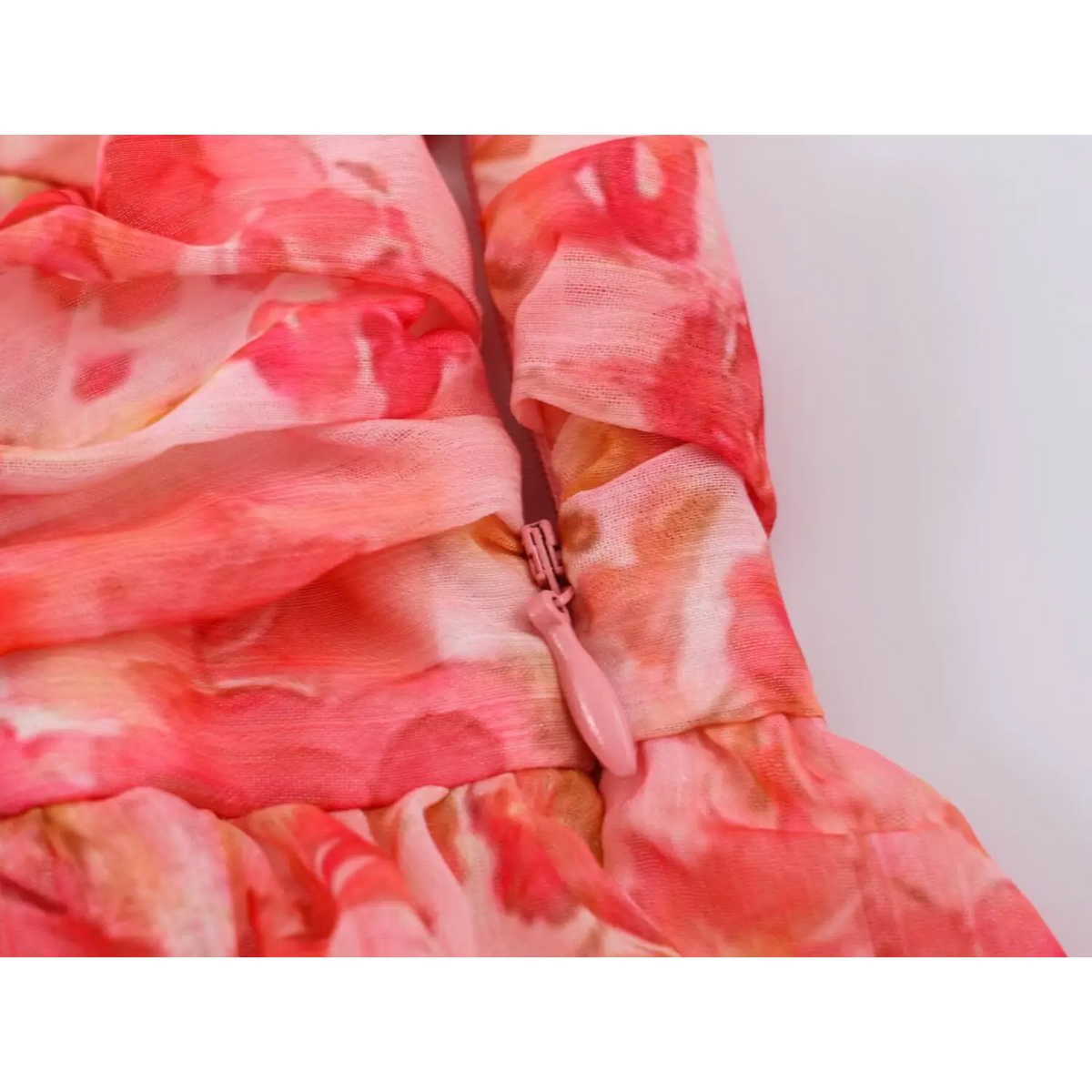 Close-up of back zipper and ruffle layers