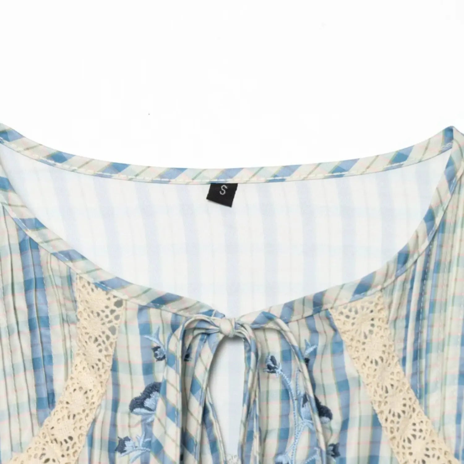Neckline binding finish with woven size label, neat overlock seam along collar edge