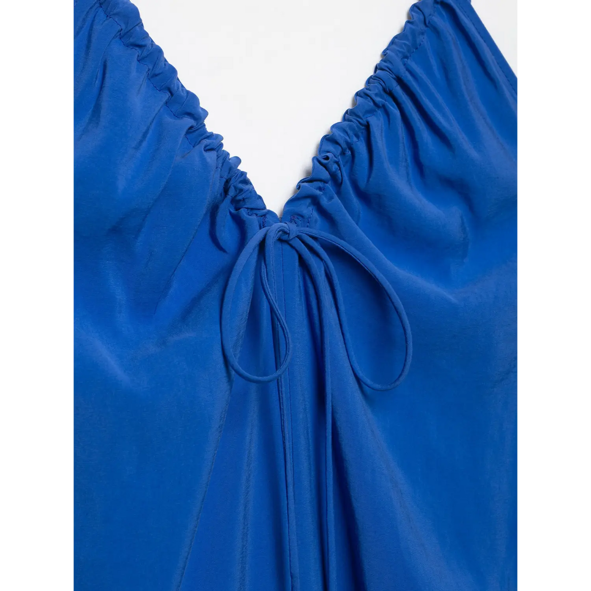 Macro close‑up of front neck tie knot detail