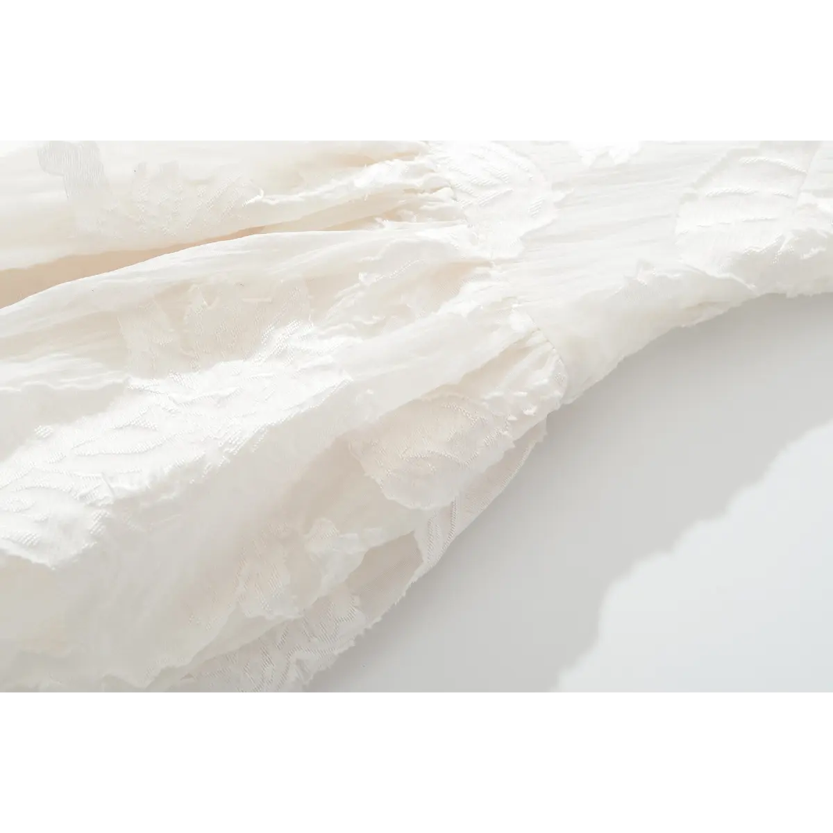 Waist gather seam & embossed flower fabric close shot