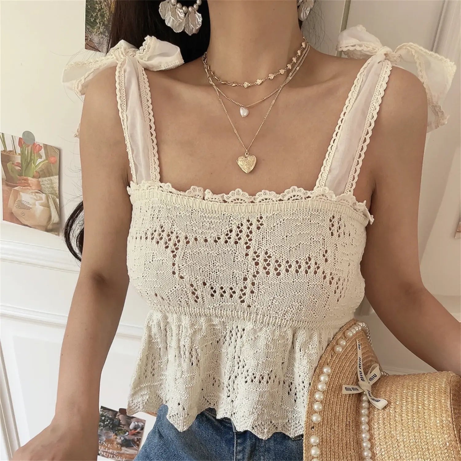 Front lifestyle photo showing lace edge straps and decorative shoulder fabric bows