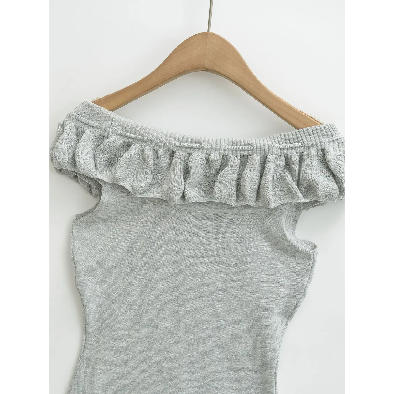Ruffle rib neck knit tube top macro flat close-up, vertical stretch rib fabric even gathered flounce neat stitching drawstring eyelet white background craft shot