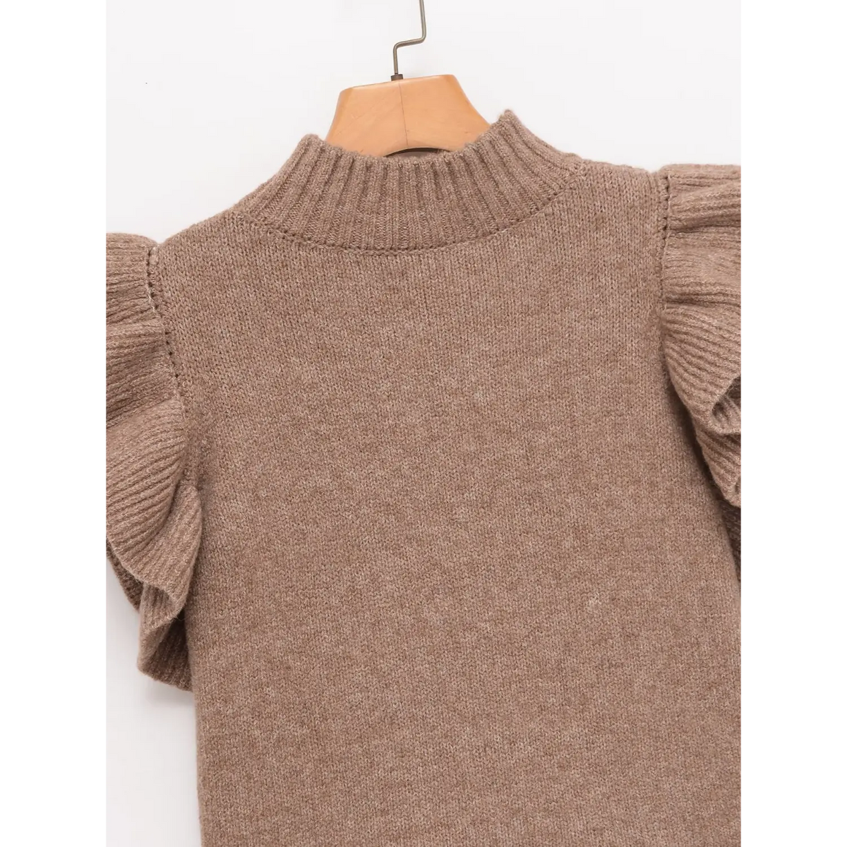 Close-up of oatmeal back neck and ruffle shoulder