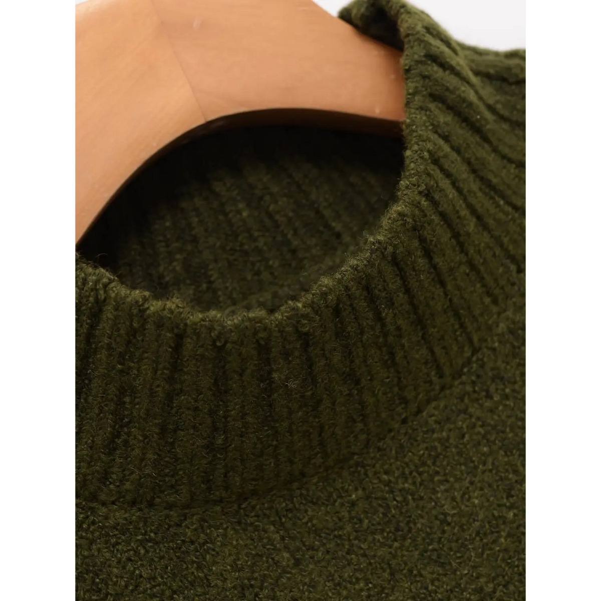 Close-up of olive green ribbed mock neck collar