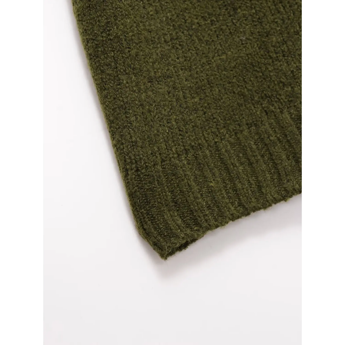Close-up of olive green ribbed hem stitching