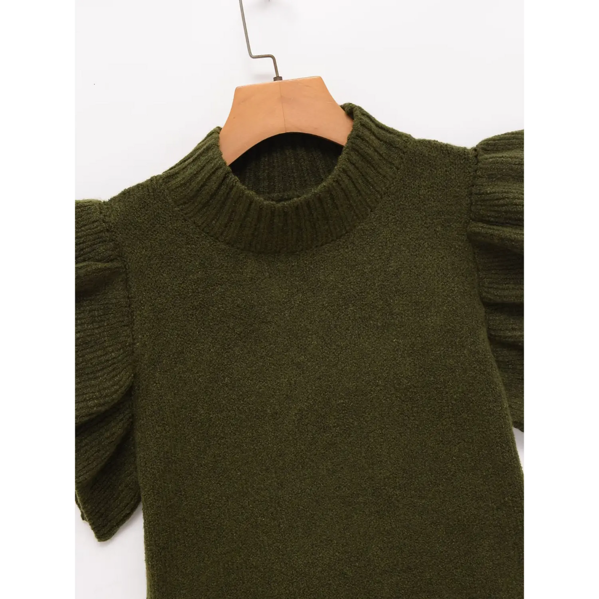 Close-up of olive green ribbed mock neck and ruffle shoulder