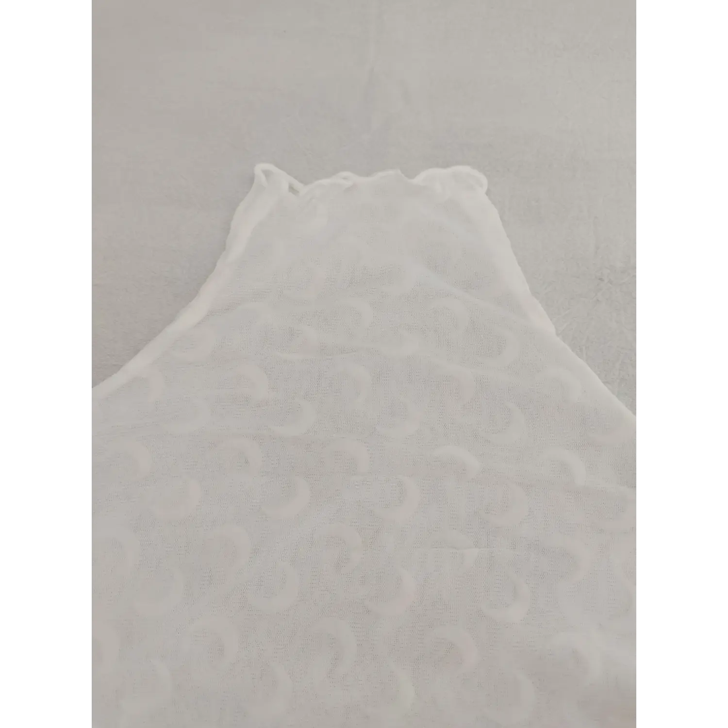 Close up ruffled high neck collar on white moon mesh layering shirt