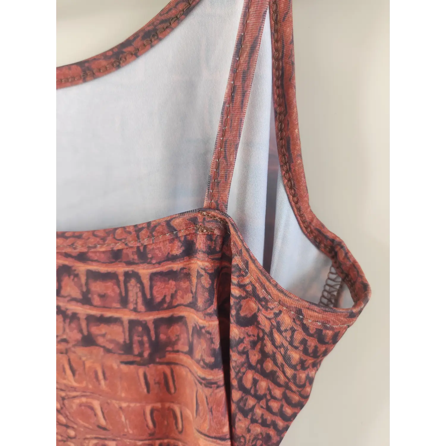 back-strap-detail-view | Close-up of inner lining and strap seam of crocodile texture print dress