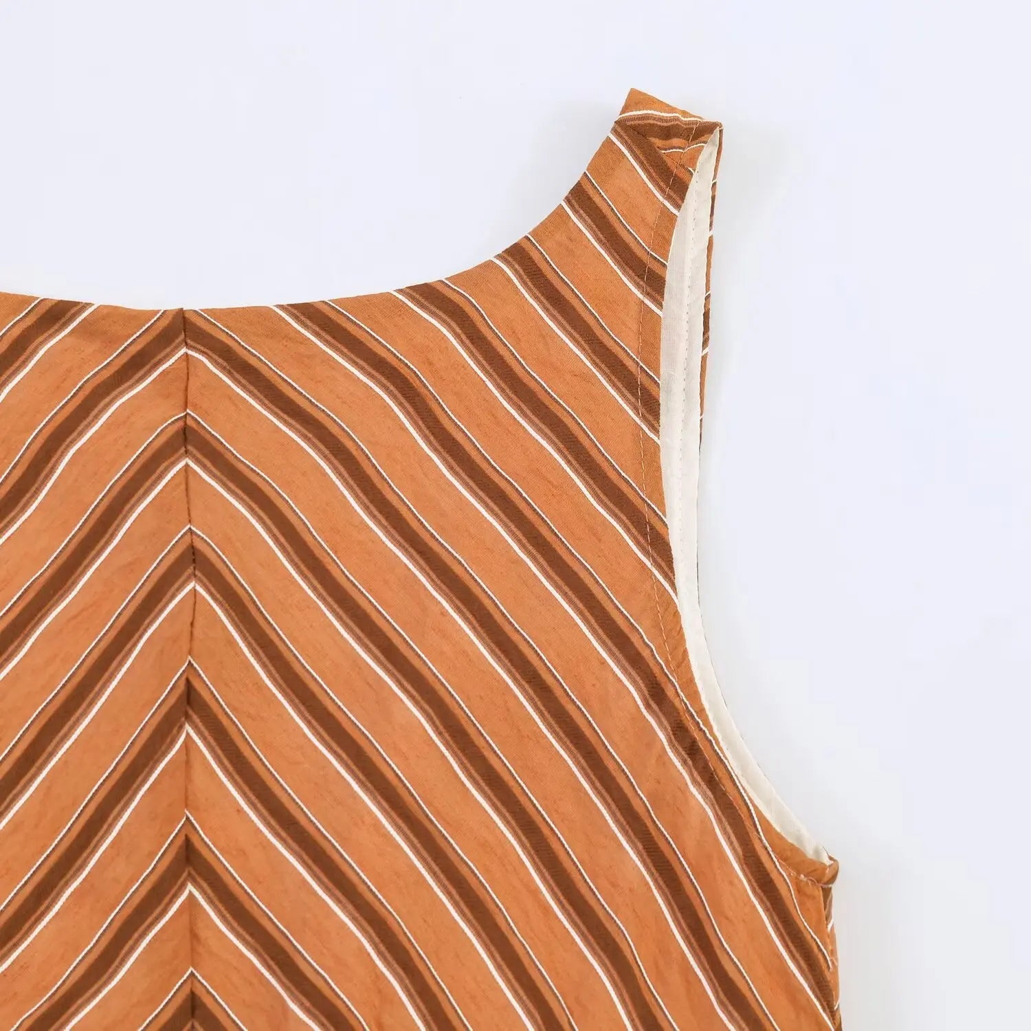 Close up of rust chevron striped maxi dress shoulder, wide sleeveless strap and stitching detail
