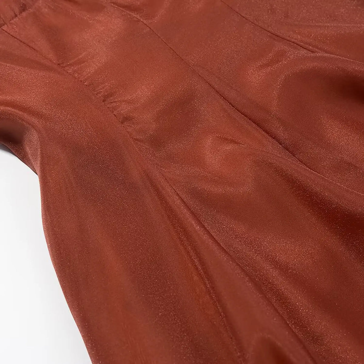 Close‑up of lightweight rust woven fabric texture