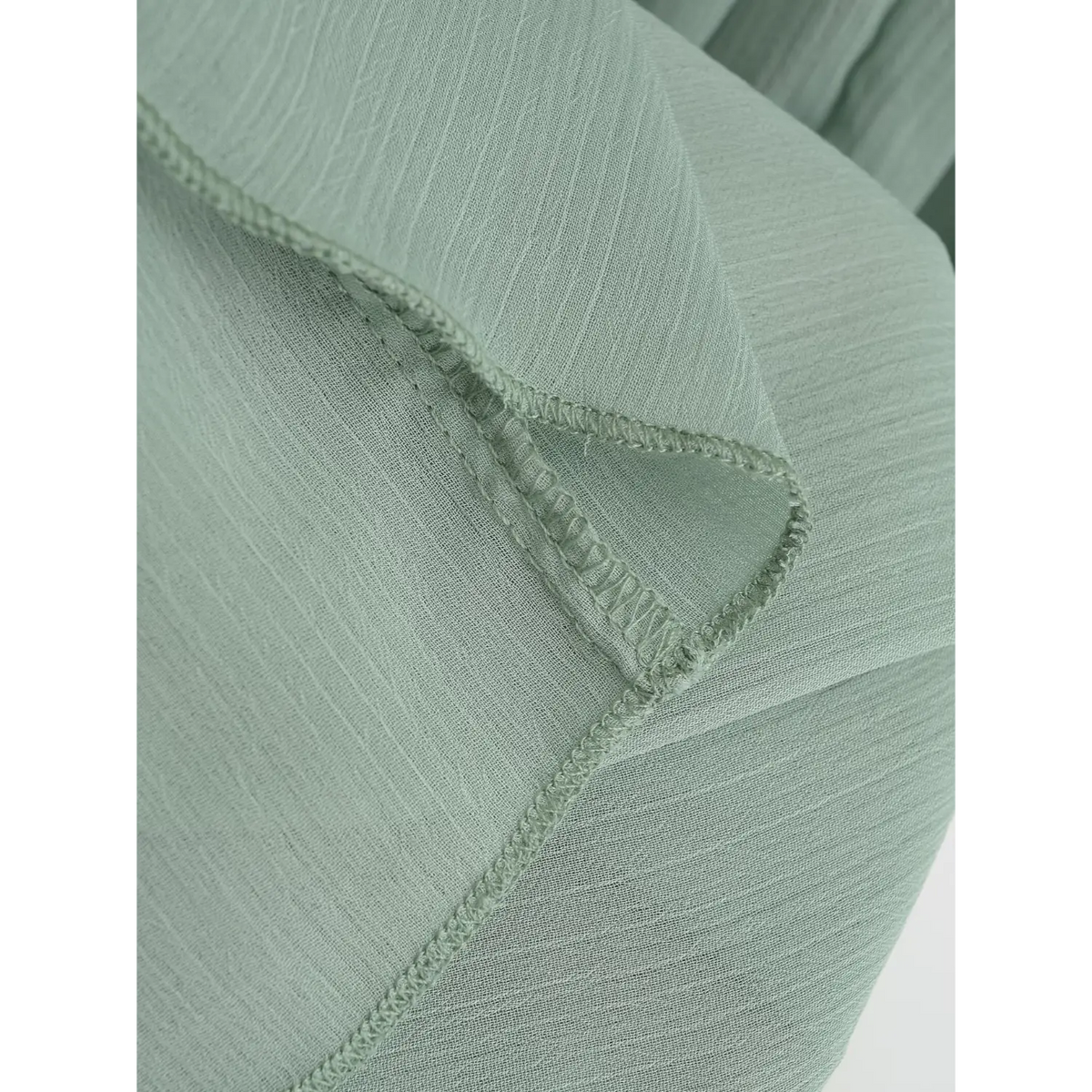 Close-up of overlocked seam stitching