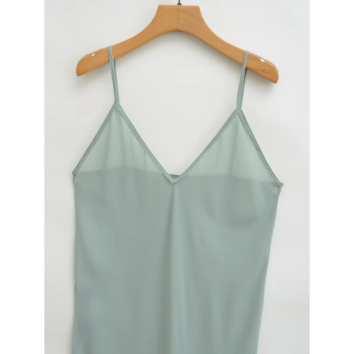 Close-up of slip dress V neckline and thin straps