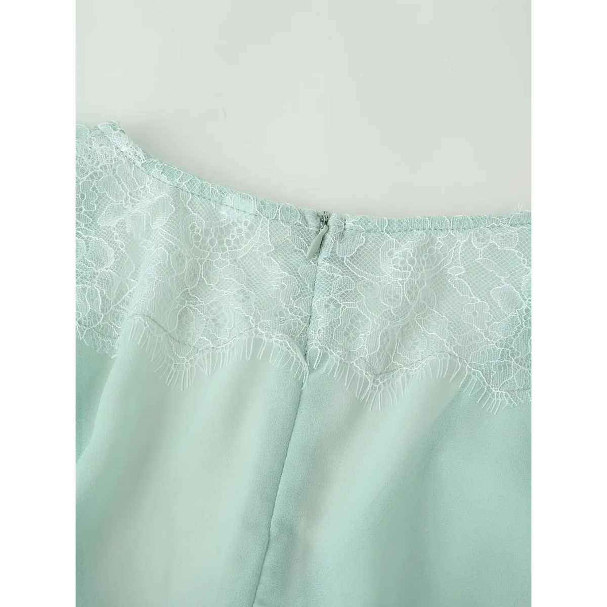 Close-up of back neck lace and zipper
