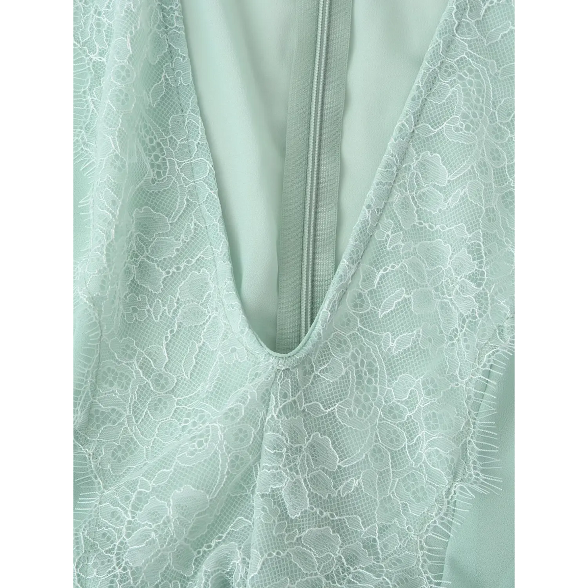 Close-up of lace neckline detail