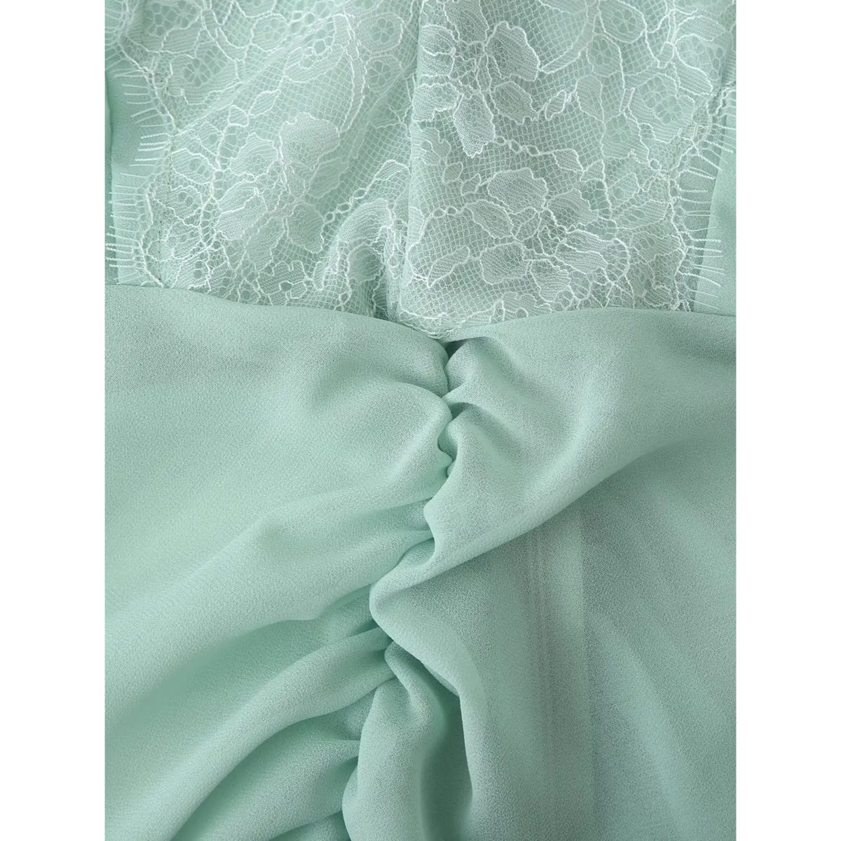 Close-up of ruched waist and lace trim