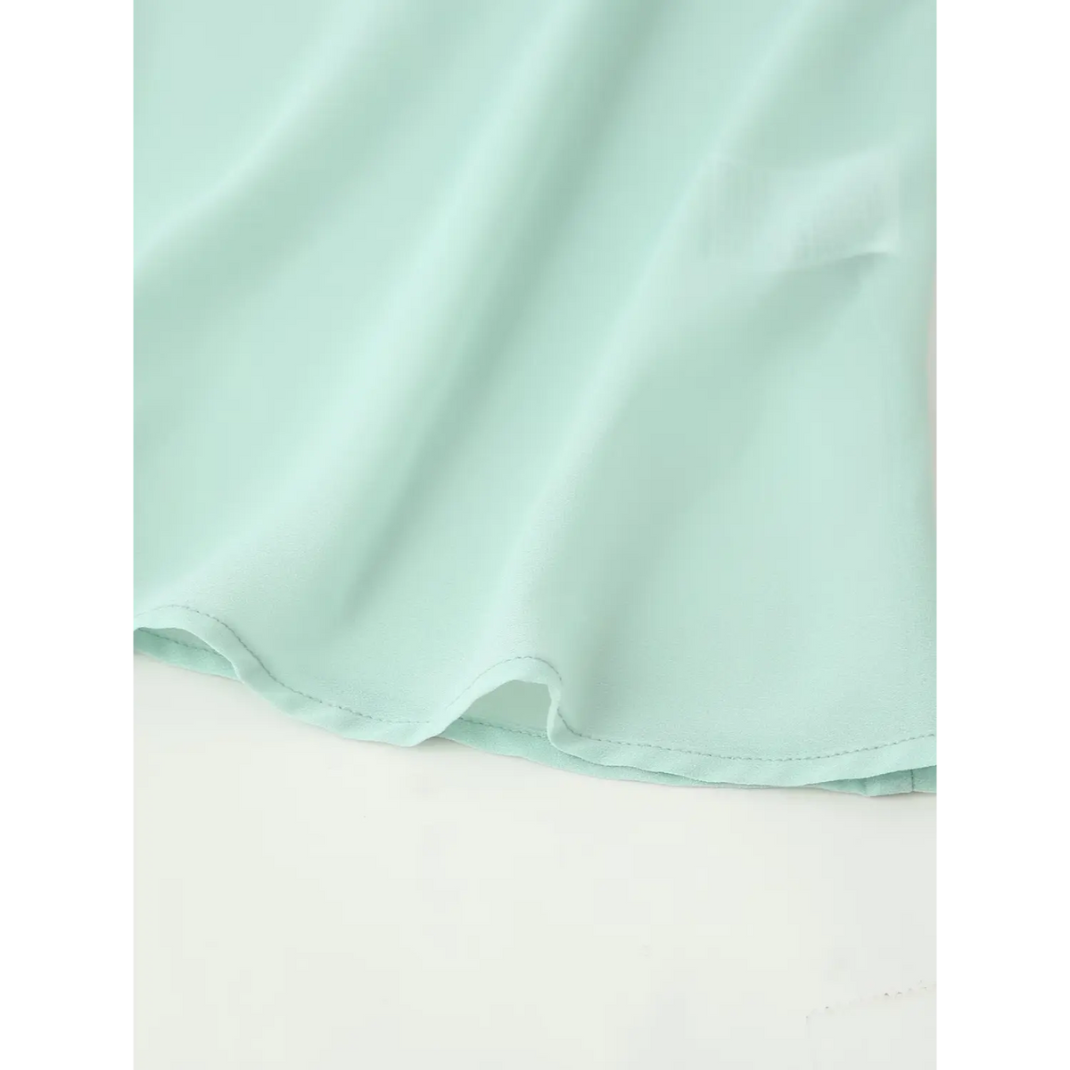 Close-up of slip dress hem