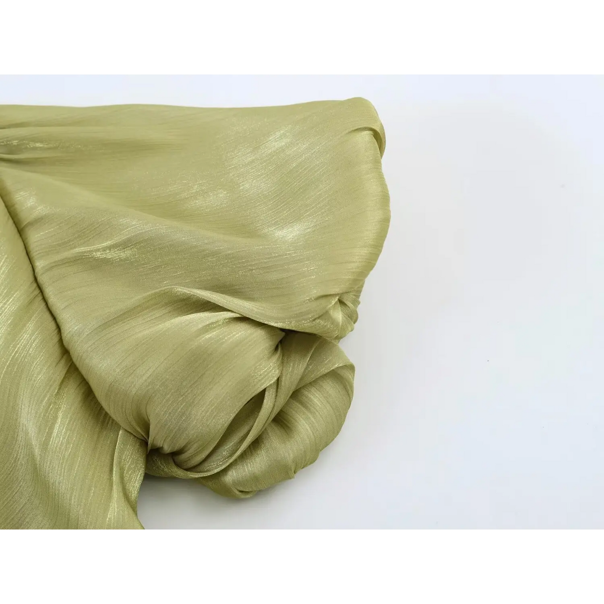 Close-up of shimmering crinkled satin fabric drape