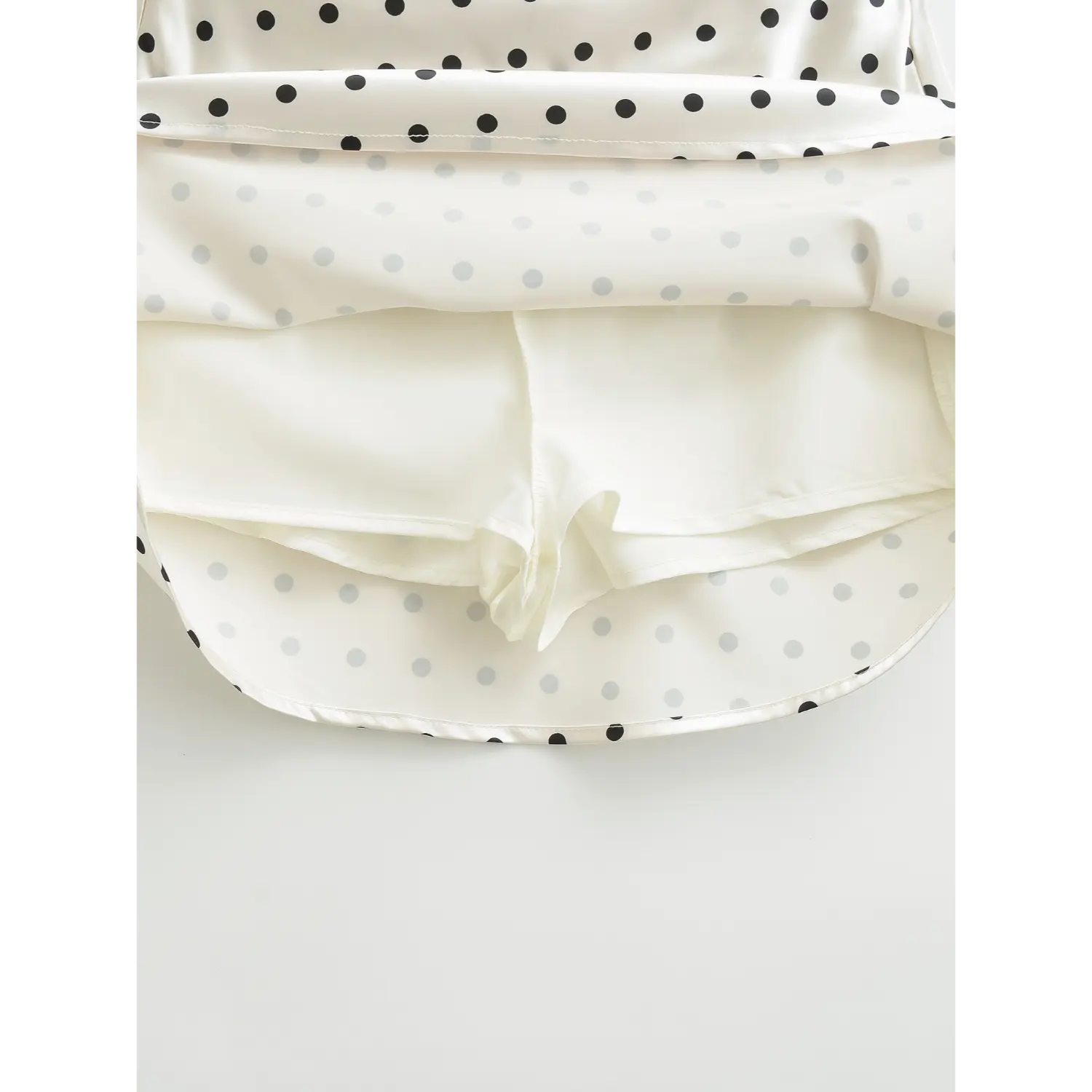 Inner layer shot, white satin mini skirt with attached safety shorts lining, anti-chafing design