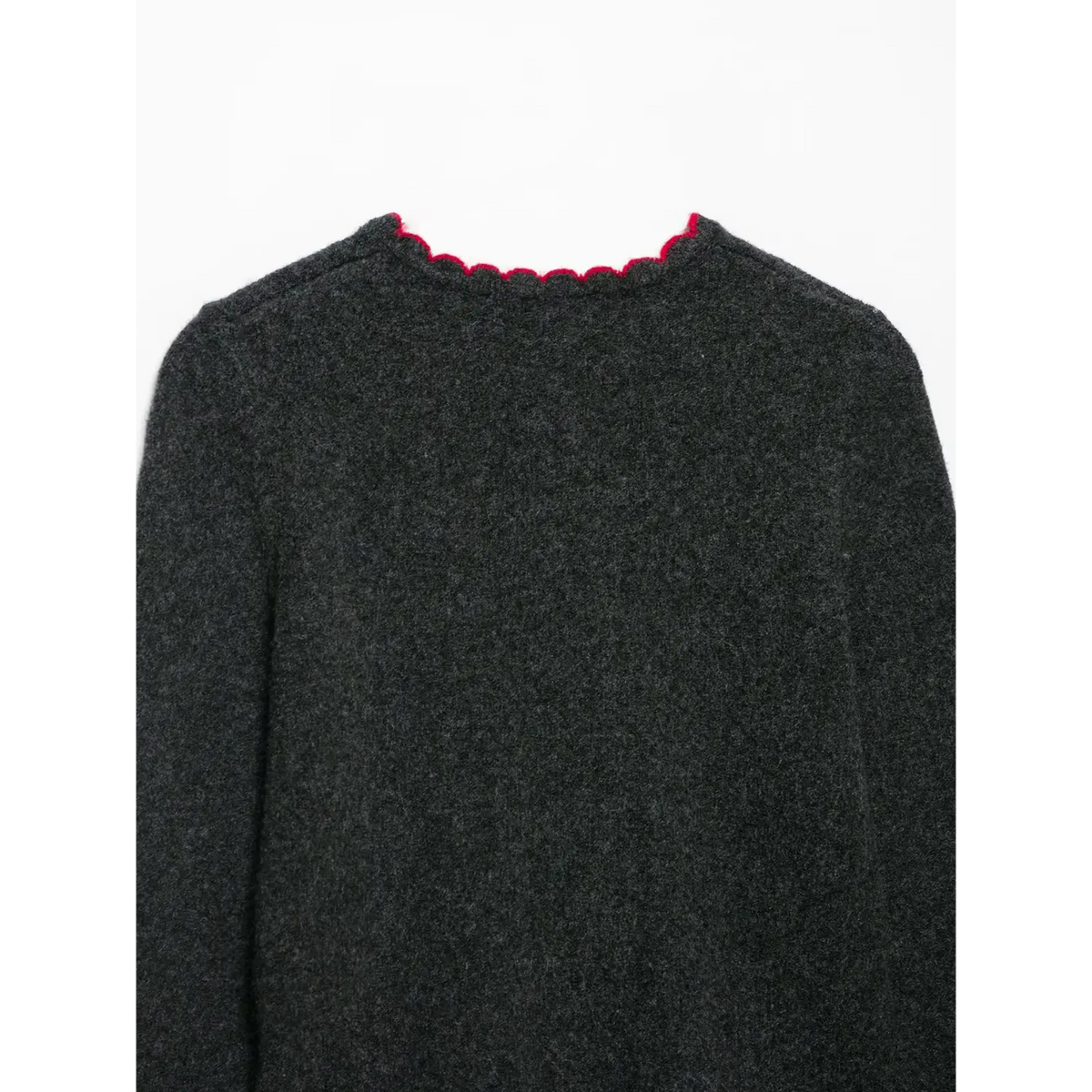 Close-up of back neckline with red scalloped edge