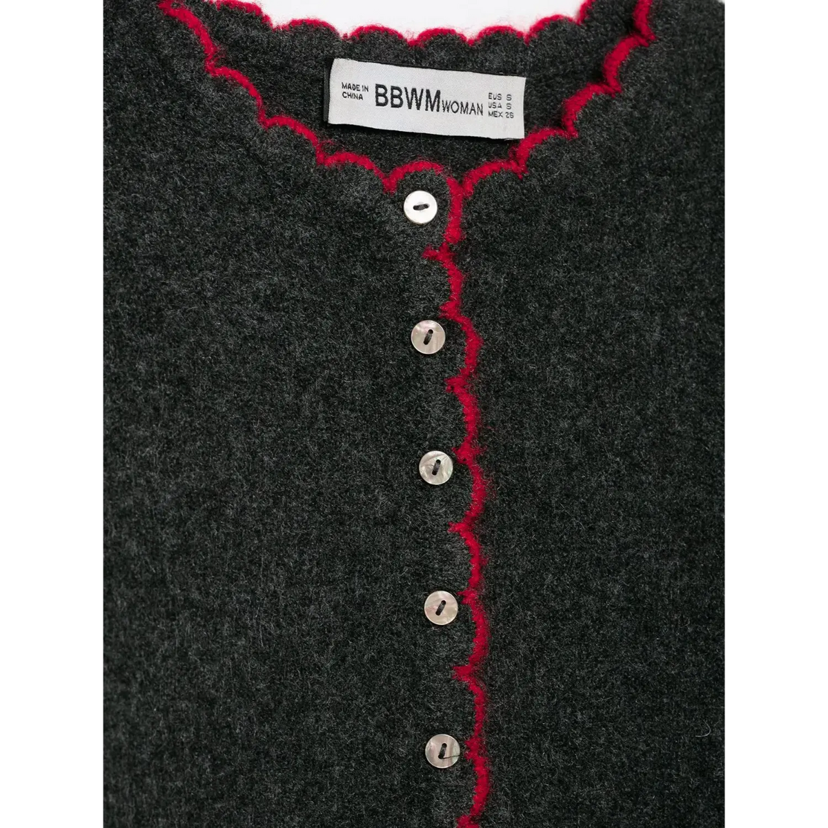 Close-up of BBWM WOMAN label and mother of pearl buttons