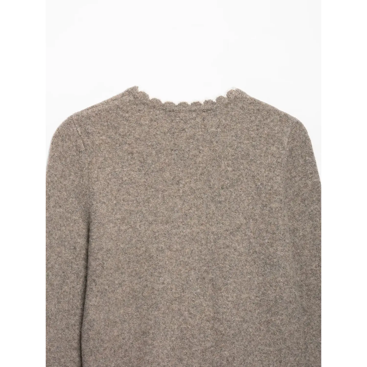 Close-up of oatmeal back neckline with white scalloped edge