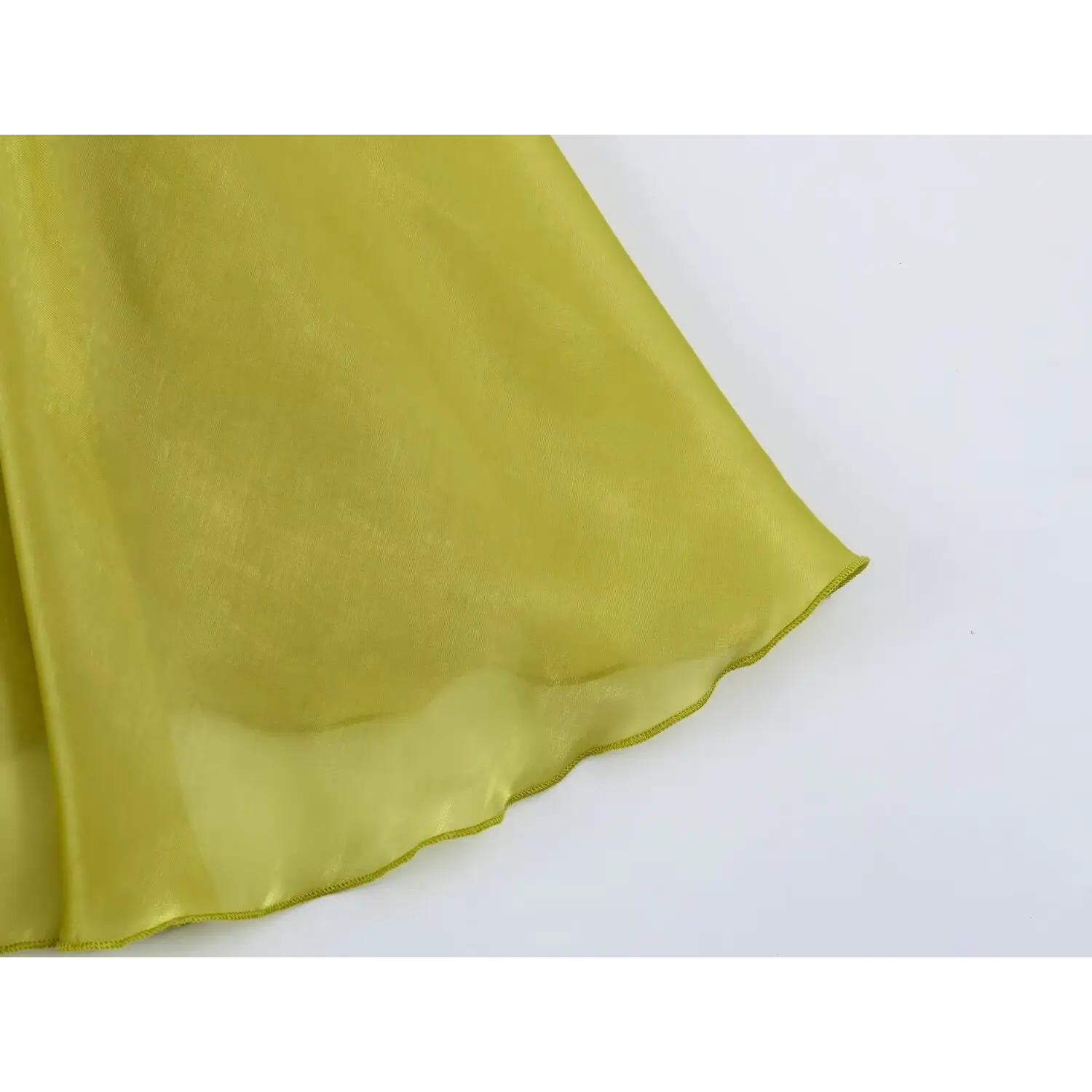 Wavy scalloped hem close-up, lustrous organza fabric chartreuse tiered maxi dress